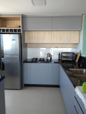 Amplo apartamento em Torres - 4 dormitórios
